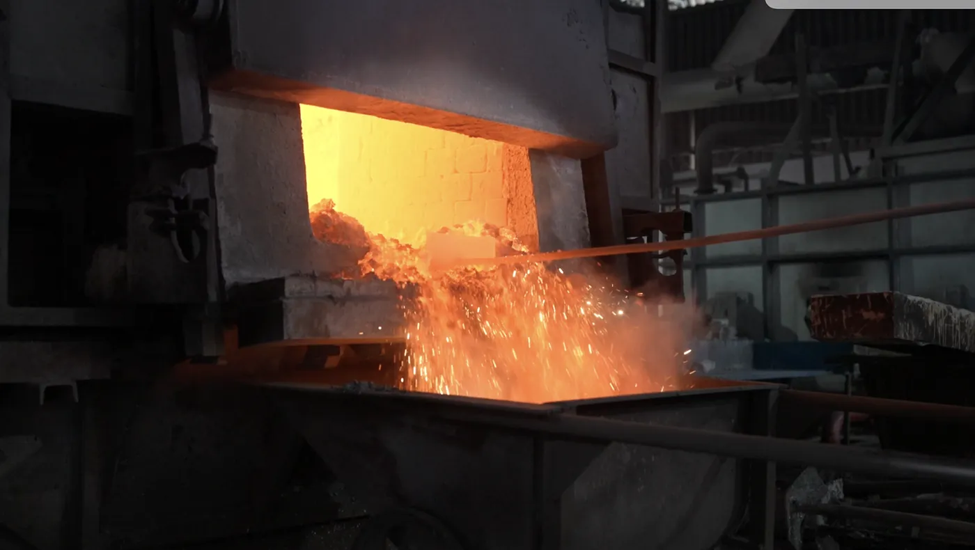 Molten aluminium being poured during billet casting
