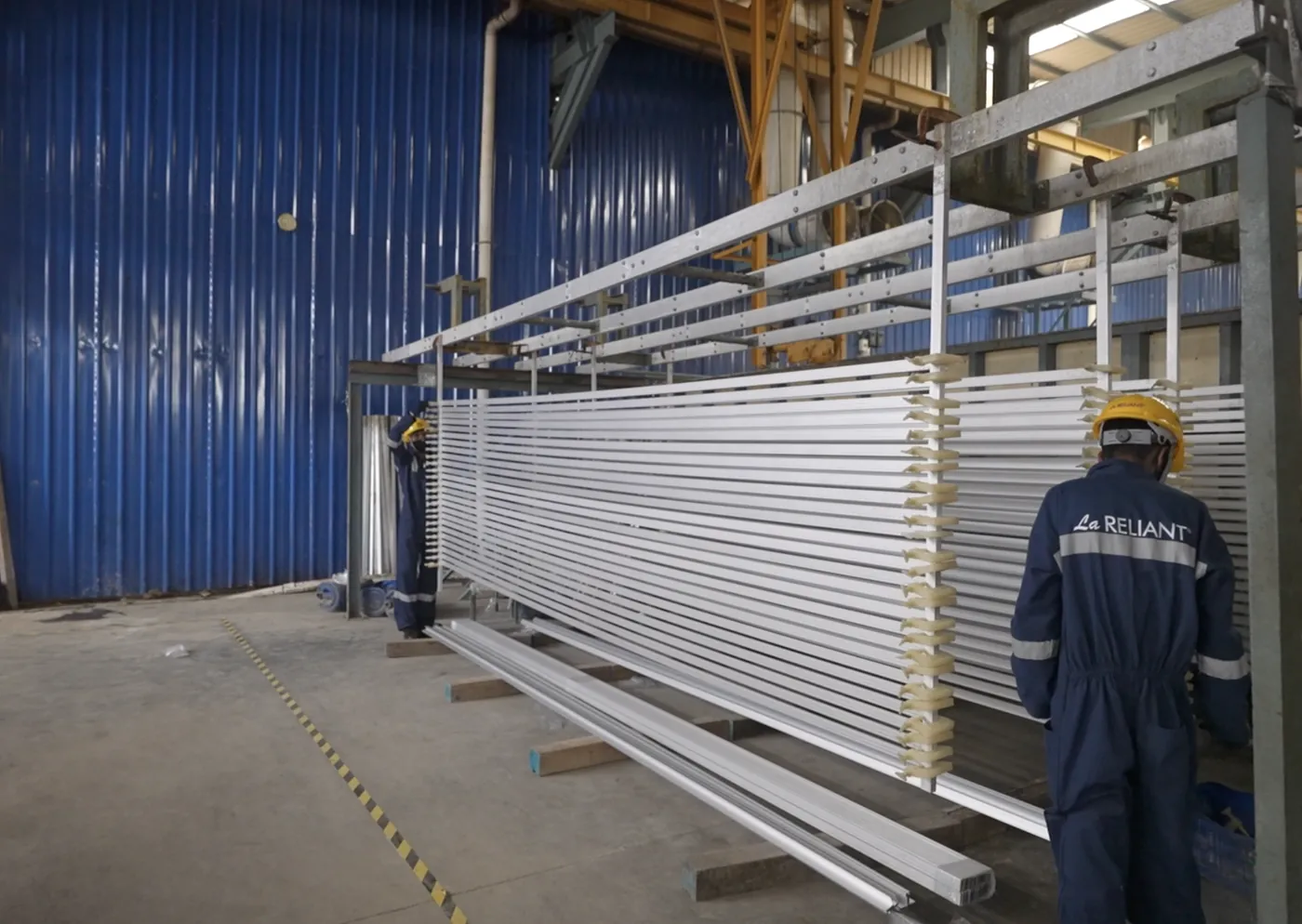 Anodized white aluminium profiles on a handling rack