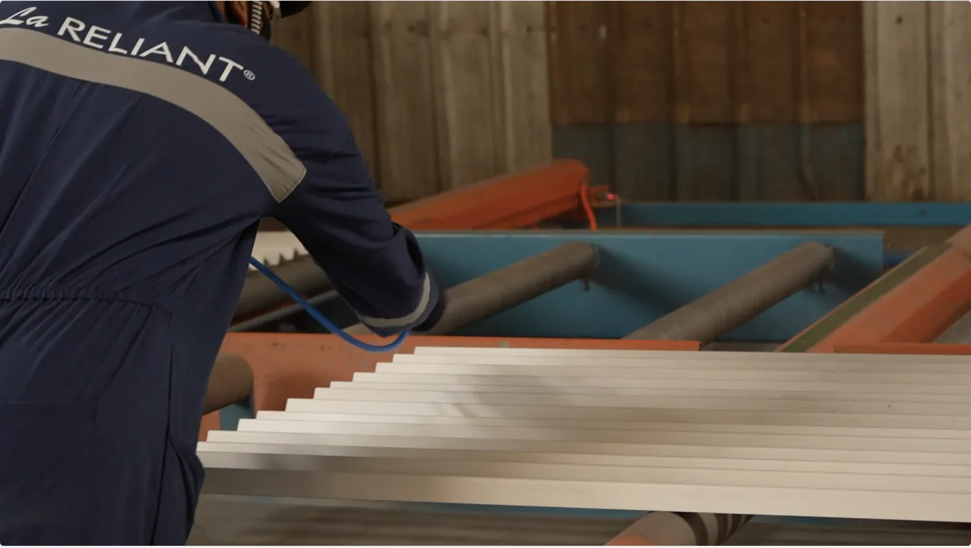 Finished sections on a roller table at the shot blasting line